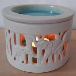 Illuminated Fair Trade elephant cutwork oil burner.